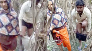 A man and woman caught having sex outside during the day.