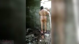 Desi Auntie undresses and gets naked in front of the camera for erotic photos.