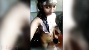 A naked teenager takes a bath in front of the camera for her lover.