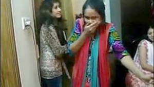 Several girls have fun and drink at a party in Dhaka’s flat and one of them kisses.