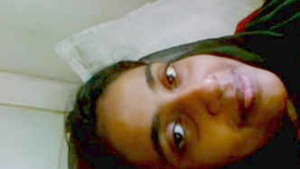 Young Indian girl from South India strips and pleasures herself.