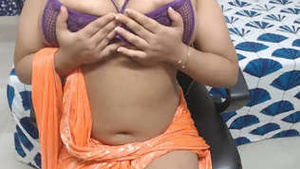 Mona, voluptuous beauty, working on her big bosom.