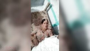 Young Indian woman seduces on camera and masturbates her juicy body for an erotic video.