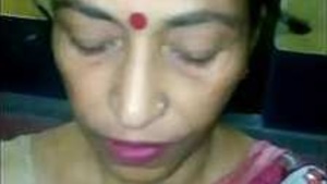 An aunt of an Indian boy sucks his friendâ€™s cock.