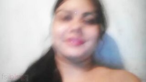 Pretty Indian woman showing her bald and juicy pussy in a homemade video