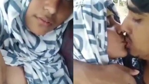 A hijabi babe from Bangladesh enjoys having her breasts kissed and sucked by her lover.