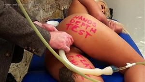 How far can we insert the enema snake into the anal passage?