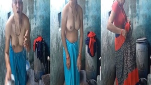 Self-styled village aunt exposes herself while taking a bath.