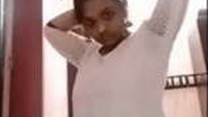 Indian girl exposing her breasts and vagina in two parts.