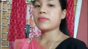 A girl from Guwahati is showing her breasts.
