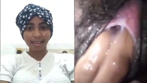 Young and ethnic Sri Lankan girl shows her hairy pussy and gets it fingered.