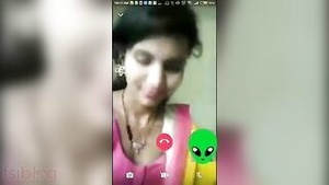 Beautiful Indian woman showing her breasts while having phone sex.