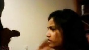 An adult teenage girl gives her boyfriend oral sex.