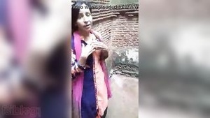 A village girl flaunts her assets outdoors for her lover.