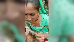 An elderly Indian woman gives a proper blow job in the woods in this MMS video.