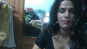 A transsexual is on camera, being feminine.