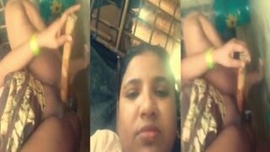 A Bhabhi from village, from India, uses a dildo to pleasure herself in an MMS style video.