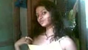 Young brunette performs solo in front of the camera.