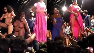 Women dancing naked in a rural village