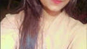 Pretty young Indian woman exposes her breasts during a video call.