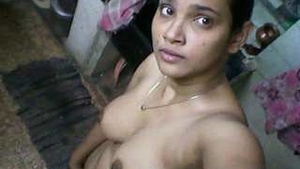 Beautiful Indian housewife undressing and exposing herself for her husband.
