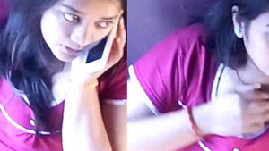 Light train trip of a innocent Indian girl who playfully touch her breast at the same time.