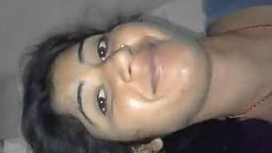 A hot young woman is flashing her breasts and rubbing her wet vagina.