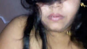 A married Indian woman with large breasts, has vaginal intercourse with her husband.