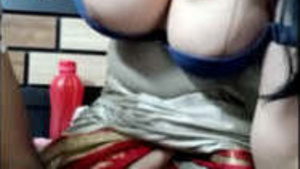 Beautiful Bhabhi showing off her shiny and erect boobs while she masturbates.