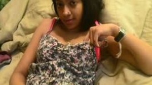 Young Indian woman masturbates herself to orgasm using her fingers.