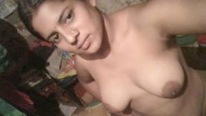 A hot Indian woman shows her body and gets naked in this video.