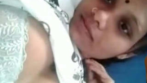 A female from Tamil Nadu displaying her large breasts.