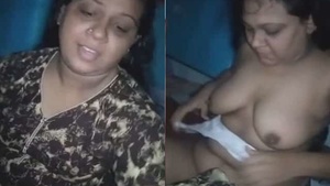 Married and shy and curvaceous woman exposes her breasts.