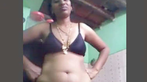 Desi auntie performs in video call.
