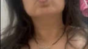 Beautiful Indian housewife exposes her breasts and genitals.