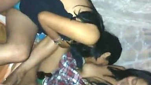 A Hindi housewife sucks the breasts of another housewife after a party game.