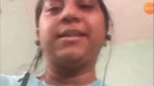 An Indian married woman exposing her breasts via video call.