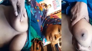 An Indian shopkeeper is seduced by an older woman who exposes her breasts.