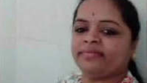 An Indian housewife masturbates during a video call.
