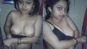Beautiful Indian bhabi showing her big boobs in a black dress