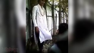 Close up shot of a college girl kissing and having fun outside.