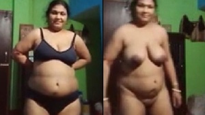 A married woman of a certain age poses naked for a video message.