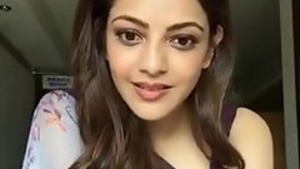 Kajal Aggarwal wears a sleeveless sari and shows her beautiful arms and melons.