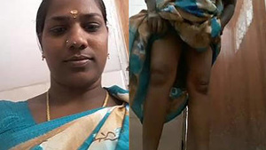 Hot elderly Indian woman urinates.
