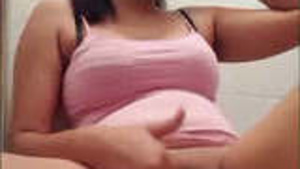 A beautiful black girl pleasuring herself.