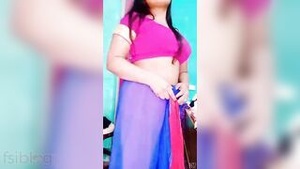 Hot Indian girl shows her big cans and shaven twat while pleasuring herself.