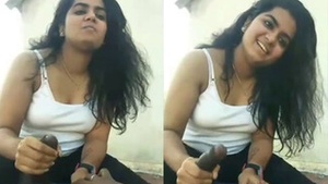 An MMS of a college girl enjoying a sensual moment with her partner.