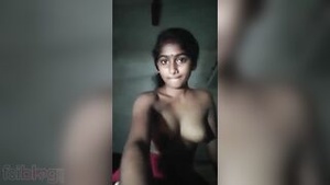 Indian house wife undressing for an erotic video.