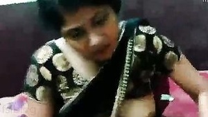 A sensual experience with the aunt-like character in a sari from an Indian porn film.