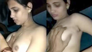 Young Indian woman takes off her bra.
